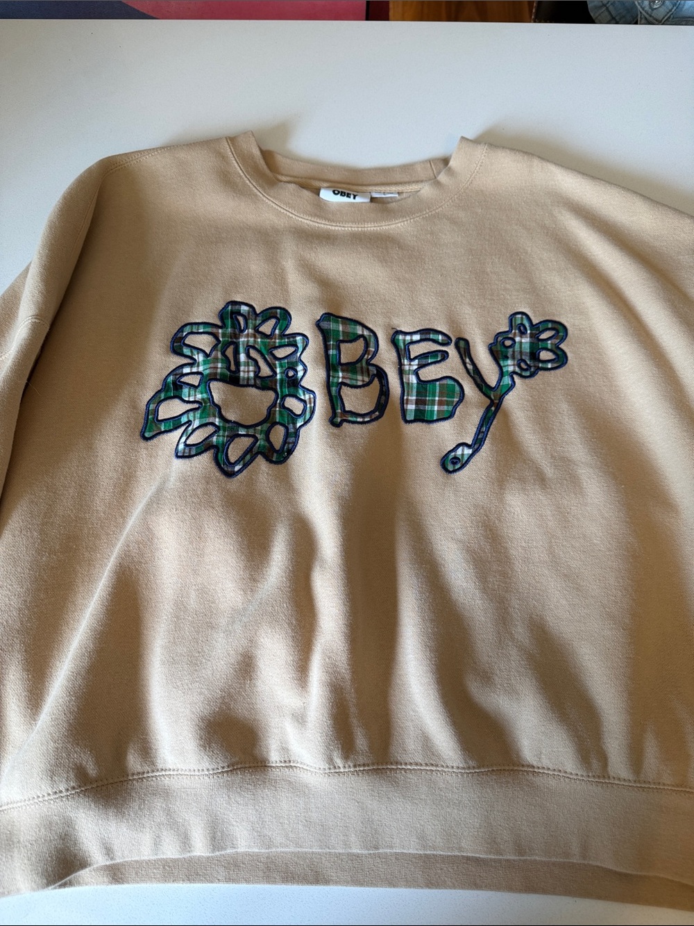 Obey Beige Crewneck Sweatshirt with Green & Navy Plaid Appliqué